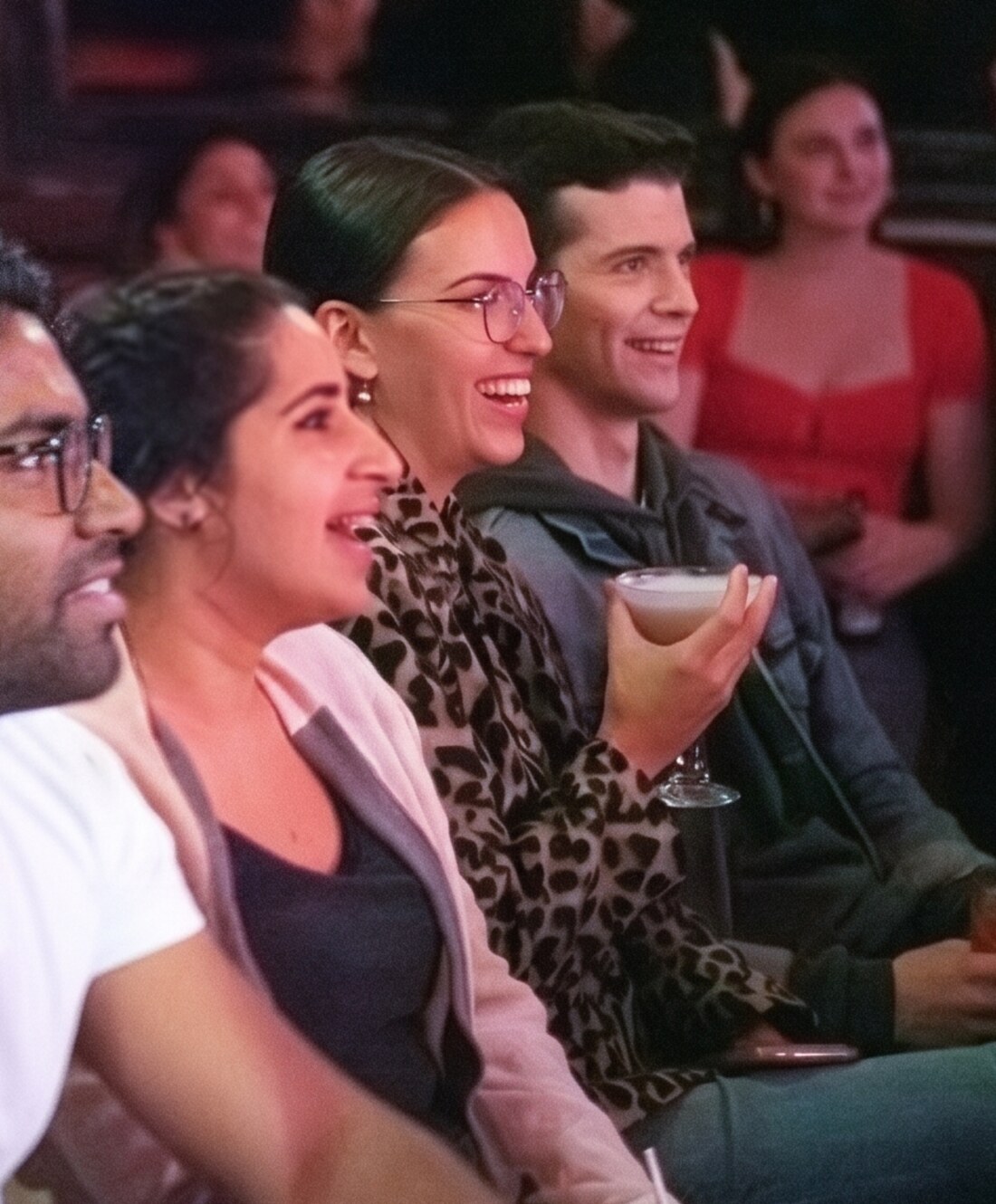 A laughing audience at Totally! Comedy Show at Bar Lubitsch