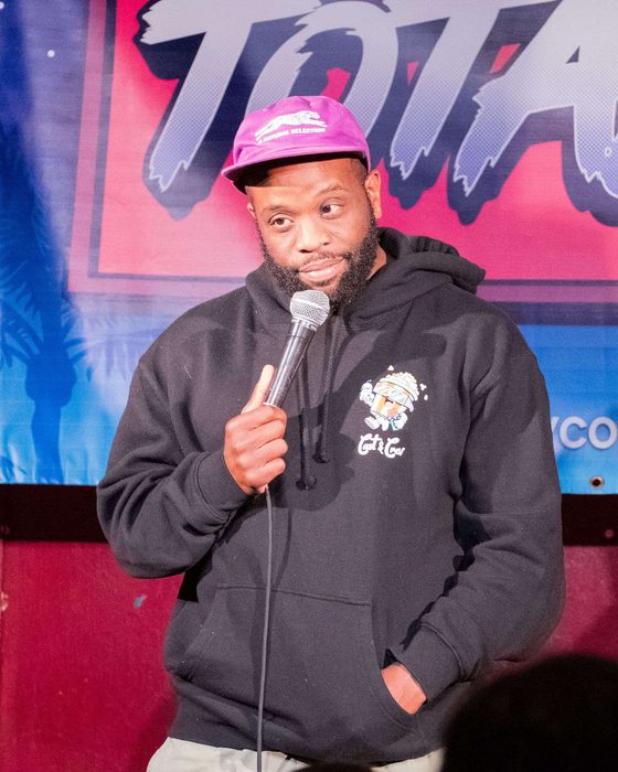 Comedian on stage at Totally! Comedy Show at Bar Lubitsch