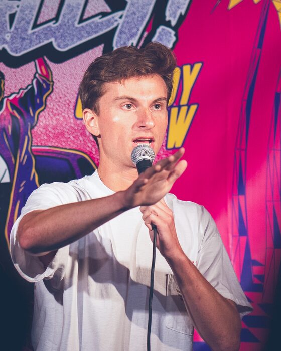 Comedian on stage at Totally! Comedy Show at Bar Lubitsch